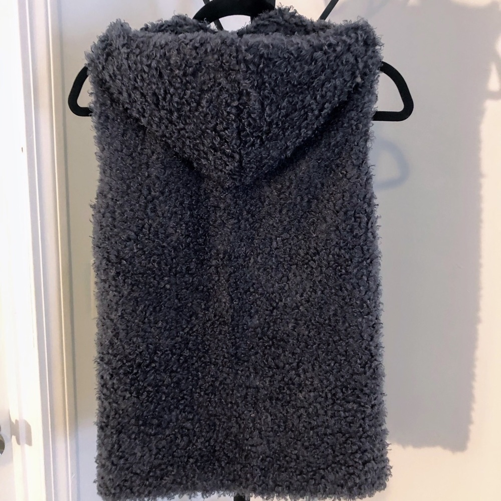 Gray vest with a hood and  pockets. Size small.